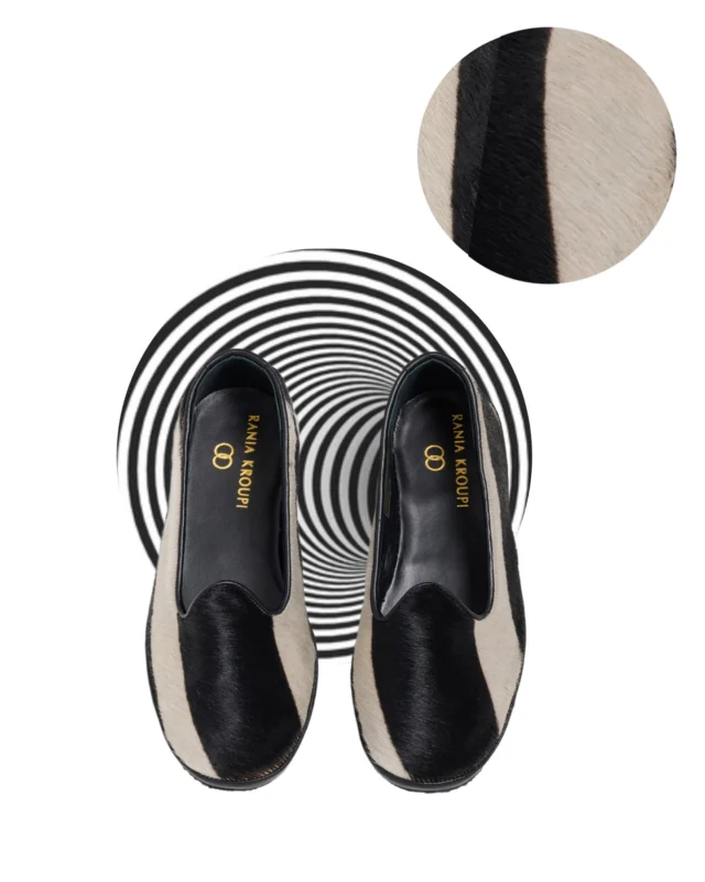 R A N I A K R O U P I. D O G E 
Δ Ο Γ Ή Σ

D O G E derives from the Latin Dux, meaning leader in Byzantine Empire and  is correlated with the chief magistrate of Venice. 
The traditional shoes of Veneto in a modern luxury edition by RANIA KROUPI.
Made by pony skin leather & leather lining with the glorious emblem of the Brand stitched by gold thread. 

Craftsmanship in details

Dare to be unique
Dare to be remembered

In our atelier HRAKLEITOU 16 |  KOLONAKI | ATHENS
