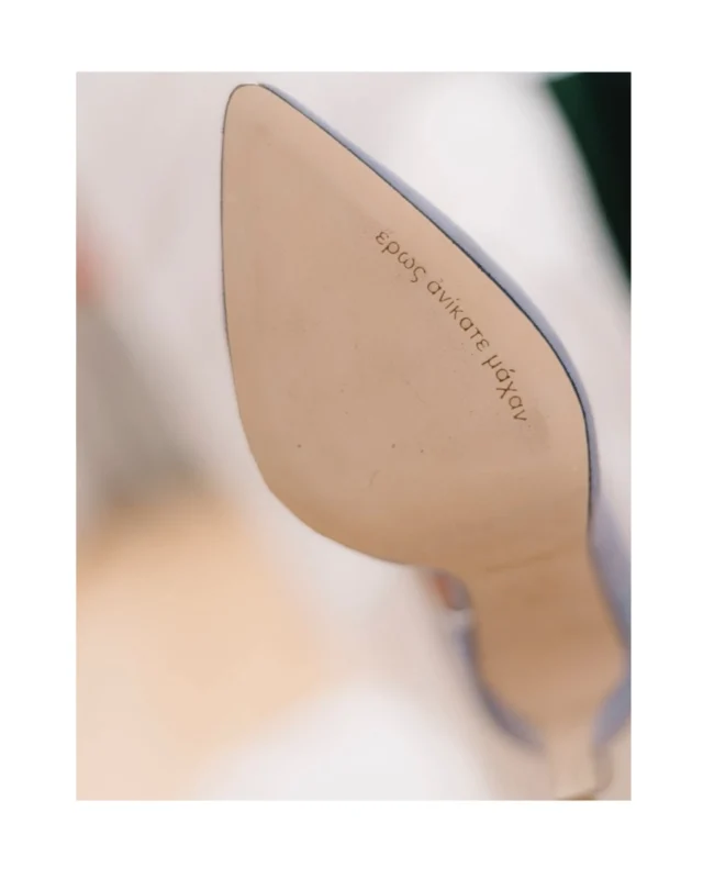 « έρως ανίκατε μάχαν”
“  love  conquers  all “
 Antigone  Sofocles
  Mardi  Panagiotis

The biggest declaration of love in the history of humanity  as expressed in Ancient Greek play “ Antigone “ is our iconic engraving under our left leather sole …
and  when our most beautiful bride wear hers RANIA  KROUPI custom made pumps ... the biggest declaration of love rises from her elegant leg to her full heart…
to her irresistible smile…
to her bright mind …
spreading her love …
embracing her happiness on this day of ‘Έρως …

Courtesy of @maridakimou_ and photo credits @manioros_dimitris